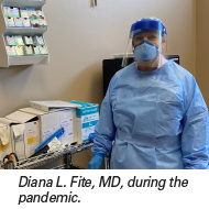 Diana L Fite MD in full PPE with caption for webNEW